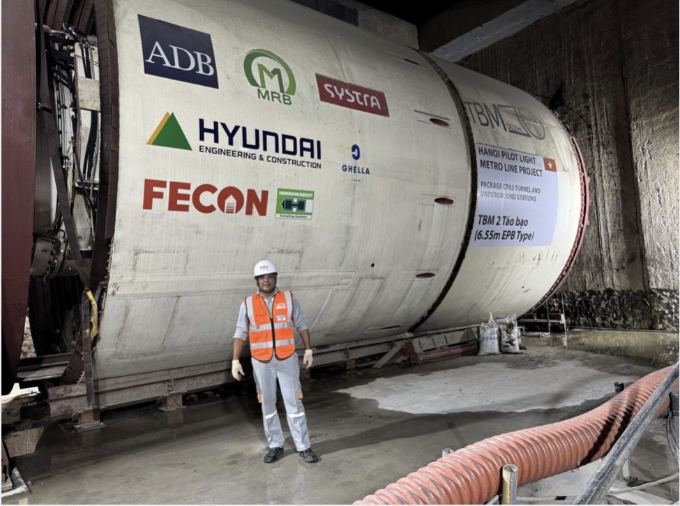 Engineer standing beside the Hanoi Metro TBM tunnel liner
