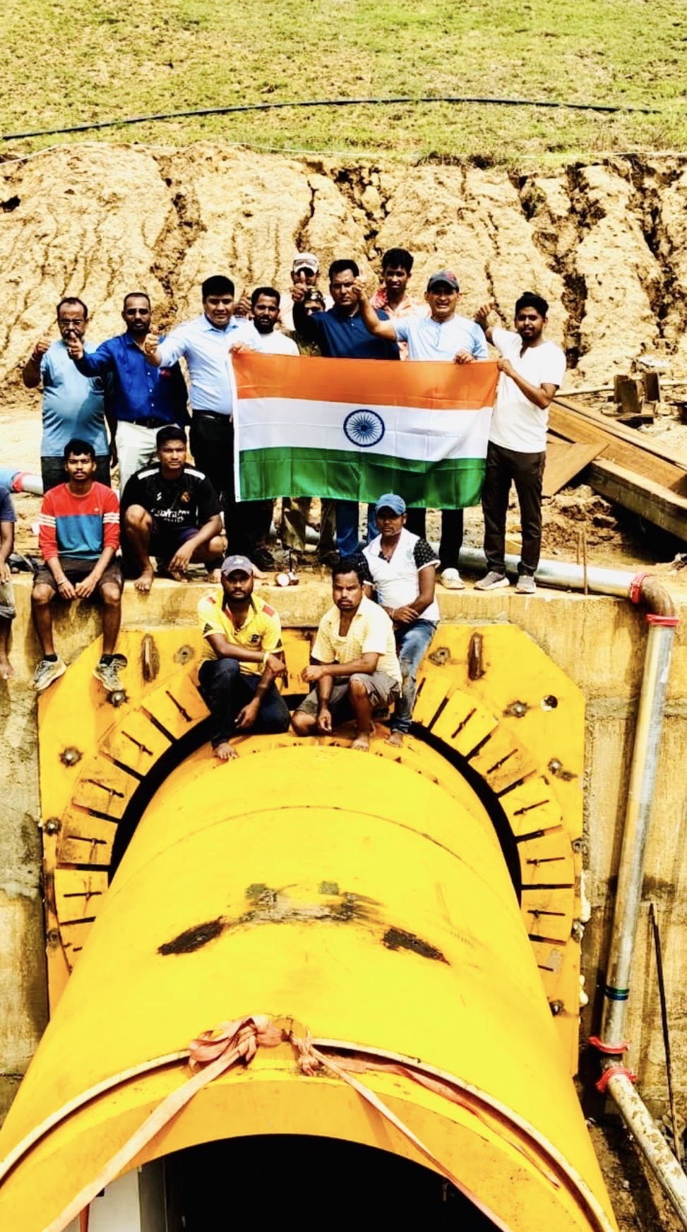 Tunnel breakthrough celebration with the Indian flag